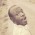Is the face of titus. Am dark brown with black hair and medium in height