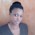 The picture is taken off white surface, it is tall and light skinned face.